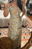 Based on the measurements on the site, I started with an XS, but it wouldn't meet in the front. The small fits well, and I have a little wiggle room if I gain or lose weight because of the wrap! I think I will only get wrap dresses in future! This is quite low cut but keeps the ladies in and doesn't show anything when I bend over. One thing is I can't raise my arms above my head. Maybe a Med would fix that issue, but I'm keeping this size because the length is perfect for no heels and no hem. - Brandy B.