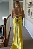 I absolutely love the dress! I originally got a small, but it was a lot tighter than expected, as the material has no stretch. So I sized up. Just needs a few alterations but it's gorgeous and high quality. I've literally wanted this since I saw 10 things I hate about you like 9 years ago. - Anne H.