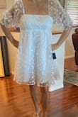 I was hoping to wear this dress for my after-party but it's a bit puffy in the front and loose near my bust line area the sleeves were loose at the shoulders. I'm not sure if it's because I ordered an X-LARGE. It's a beautiful dress. - Ernestine D.