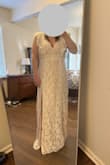 Love this dress. It is long, but to be fair I am in the shorter size. The lace is a little "fuzzy" and looks like otherwise good quality. - Kelsey J.