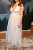 This dress was just the right amount of elegance and simplicity for my small courthouse wedding. It was very long so I had to hem it before the big day. Fit my breasts and make them look great! I'll likely wear this again for a vow renewal. - Jennifer C.