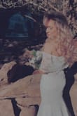 Wore this beautiful wedding dress for my elopement ceremony. This dress fits in all the right places! I didn't need any alterations. It was easy to steam to remove wrinkles from shipping. The shipping to exchange was extremely fast. Although I had measurements to fit a medium, it was too big, but the small fit perfectly; I also have an athletic build that fits S/M. I received so many compliments for the off-the-shoulder look! - Moriah L.