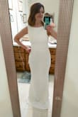 It fits great and the fabric is nice and stretchy! I do need to find just the right shapewear to make it perfect. The seams around my butt area want to show, and that doesn't look great, but I think shapewear will fix that. - Leslie D.