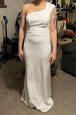 The fit in the top was too loose. May have needed to size down for a tighter fit. Did not choose this dress. Really pretty though - Tanaesha L.