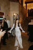 I purchased this for my wedding - I was worried about being uncomfortable in my main dress all night and wanted a backup to change into. I am so glad I bought a second dress and changed - this dress is so comfy (compared to my main dress which was tight, beaded, and heavy lol). I wanted something with a bit of a vintage/classic feel and this was perfect! It was big on me so I got it altered (which cost as much as the dress unfortunately) I just needed the waist area taken in and the bottom hemmed to my preferred length. Overall the dress was a hit and when I changed I felt a (literal and figurative) weight lift off my shoulders. SO comfy and beautiful! I washed it myself after the wedding in the washing machine- all the spots came out and it's good as new! - Lexi D.