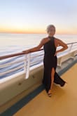I originally ordered this dress in a medium, but it was a little big, so I quickly ordered a small. The small is perfect. I wore it for formal night on my cruise. It was a little long, but I wore platforms and was fine. It did show a little side boob, but it was fine. I got so many compliments. - Jessica J.