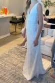 I loved this dress!! The BOW tie straps were STUNNING!! This dress fit pretty well but was just a little big in the top, but it was a stunning dress. I loved it! - Elyssa H.