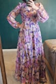 It's really flowy lightweight material. Beautiful almost art nouveau-style floral print. I ordered a Small and Medium, the Small fit perfectly.  I'm usually a dress size 4 or 5. - Natalie L.