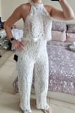 I bought it for my wedding reception so I can dance more comfortably. It's a beautiful jumpsuit and I'll definitely wear it, but it runs a little short between the crotch and neck area so it pulls a tiny bit on the neck. The upside is that it hugs the butt. If I bought again, I'd size up and get the waist taken in. - Nasim B.