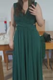 I loved the dress. The material has weight and it looks and feels amazing. The color is beautiful. The purchase of this dress was totally worth it. 
I have to say I purchased a size L because I wanted to make sure it could be fitted to my body. To be honest, I should have bought the size M. The L was too big, even for fitting. But that was on me. I had to fit it more than expected, but in the end, it looked amazing. - Nina M.