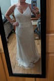 This dress style is hands down what I am going to wear for my wedding. The beading it absolutely gorgeous, and the way the beads flow on this dress gives you the shape that accentuates all the right curves. The reason why I said yes to the style is, I was debating whether I would be a small or a medium. I ordered the medium first, and lo and behold, it is just a little too big. I would say that the medium does fit true to size, but just not my size. I was on the edge of being a small or a medium. This dress does not have any stretch to it so that why I sized up. I have now ordered a small and will be returning the medium. For all you short gals out there, you will have to have the dress hemmed up or will have to wear some tall heels. The straps are on the thinner side, and the straps shorten to the front of the dress. The dress has a super soft interior slip, and the beading under the arm is low enough that they won't cause irritation. Buy this dress!!! - Macy F.