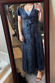 I bought three dresses and even this same dress in another color, and I ended up liking the navy blue one the best! It's for my Brother in Law's wedding in Mexico, and it is lightweight enough that I won't get too hot, but when it cools down for the night, I won't be too cold! The only critique I would say is, for my bustier ladies, it is very revealing. I wish it had a clasp to keep the girls secure, but it does not! I'm sure it would look great on those more flat-chested, but I will need to wear a cami or bralette to reel the girls in a bit! - Ashlyn H.