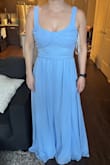Fits true to size but the cinched part didn't hit me on my natural waist. I will tie the bow a little lower so I don't look like a rectangle and it'll still work. Beautiful color and supportive. I won't need to wear a bra and I typically need to. - Laura R.