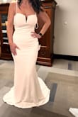 I bought this and one other dress for my elopement and reception, and this dress fit perfectly! I felt confident in the material, and it hugs in all the right places. The material is kinda stretchy, but unfortunately, it seems a little more snug than what I'm comfortable with - Jordan M.
