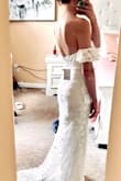 This dress is not only beautiful, it's extremely affordable. The material is great quality and it hugs me everywhere I want it to. Love the small lace train at the bottom. Perfect amount for my outdoor wedding! - Rachel B.