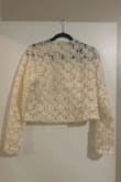 This item was a huge disappointment. While it fits me, it is fairly snug. It is very cropped, much more so than the website photos depict. The color is more of an ivory than a white, and most importantly, it was SO itchy. I had to take it off immediately. Will be returning. - Layla H.