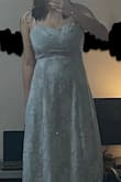 I like the design of this dress a lot! I can see why people would say the material is cheap, but I would be happy wearing it without feeling cheap or anything like that. Although, for the price, one might expect something to feel a bit more sturdy. Either way, if my body fit the dress just a little bit better than intended, it would've been perfect, but I think my bust was just a bit too big and I was a bit short. It was a cute length as a small (though longer than on the model, it was a few inches above the ankles), but the medium was basically a maxi on me (to the ankles) and the 'hip' shape of the dress was a bit too low. I exchanged the S for a M because my bust looked a bit awkward being larger than the sewn in cups, but the medium was too loose. The cups are also purely aesthetic, but nothing a strapless bra couldn't fix, BUT my boobs were still bigger than the dress suggested they should be. The S ~just~ barely fit, but I would've kept it if the bust fit better. :( - Katie J.