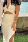 I am usually a S but ordered XS because I wanted it to be extra form-fitting. So glad I did. I ordered the white one, and it is double-lined so it is not see through! It's thick material and hugged my body. I used boob tape for the girls! - Yudenis R.