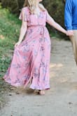 I purchased this dress for my engagement photos and LOVED how they came out! I went braless which was fine for photos, but I would probably use a bit of tape or something to keep the top in place if I wear the dress again for an event. I had to have it hemmed quite a bit, but that's normal for me given my height. Definitely recommend! - Alyssa L.