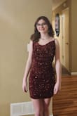 I purchased this dress for my daughter for her junior high Valentine's dance. She loved it from the moment she received it!! The material is slightly stretchy, but it literally and beautifully fit to a T!! The sequins are shiny and stitched perfectly so no issues with those. She had a wonderful time at the dance and looked absolutely gorgeous!! - Nikki C.