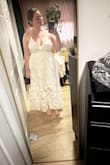 I think if you are less curvy than I am, it would lay nicer! The straps are just too thin and do not have a lot of support. A pretty dress but didn't work for me. - Alethea R.