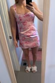 I am an athletic build and a little curvy around the waist. I have very broad shoulders as well. I did order a size too small(no mediums left). The material and design are both great. Unfortunately, it is very tight around the hips and thighs but noticeably loose around the lower belly area. I think this would be an issue even with the medium. It is also tight around my rib cage area, but I don't think this would be an issue with a medium size. The material does not stretch at all. I think I will bring it in to get tailored though because it would look sooo cute if it fit properly. I think this dress would fit well on a petite-sized person. - Jenni