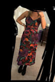 This dress fits TTS. I agree with other reviews that it is tight and might get uncomfortable if you eat too much. The top does slightly flare out by the armpits making it appear too big. The back is too low to be able to wear a bra. If you sit down for a while and stand up the top printed layer clings and at least an inch of the lining will be showing at the bottom. Still unsure about the print, can't decide if it's cute or looks like grandma's couch. - Laura S.