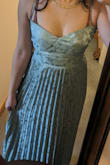 The dress is GORGEOUS in person. I love it. I just wasn't my style and didnt do me any favors, perhaps for a different body type. It accentuated my chest tho, which was nice. Zipper sucked. Took a village to zip this dress up. - Bliss D.