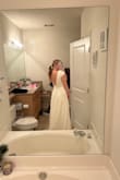 This dress is very plain, but the back is very beautiful! Runs a bit big in the top front. Not my style but the back is so pretty - Hannah S.
