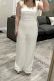 Beautiful but see through, fabric is nice but could be a little higher quality. The stitching does not line up, which makes the stitching super noticeable. The jumpsuit is also not made for short folks & the torso is too long, and the straight line stitch from the crotch to high waist just accentuates the fact that it doesn't fit a shorter torso well. - Mackenzie R.