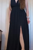 My concern when purchasing this was that the bust would sag open and I would have to sew it up; without a bra, it did. However, with a bra, it laid perfectly flat, and I was pleasantly surprised. The skirt is full enough that the slit is not noticeable unless you want it to be. As with all Lulus dresses, it needs hemming even with 4in heels, but I am okay with that. Lulus always provides me well-fitting formal wear at an affordable price! - Ginger I.