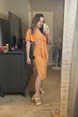 Love this dress! It fits perfectly, not too tight and not too big. You can tie the front, and I was able to tie it to fit my not-so-chesty area. There were a couple of loose threads in the back by the zipper - Presley C.