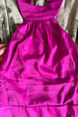 The dress seems like decent quality and it fits well. It doesn't look as pictured though. It's much more purple than a magenta. The photo looks a lot more pink than it is. - Dawn B.