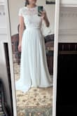 I bought this for a potential wedding dress for my intimate wedding. This felt fun and relaxed but also fancy enough to be used as a wedding dress. I'm a very petite person with a small bust but curvy hips. The top "fit" but I felt like movement around the arms was a tad restrictive. Also, I didn't love that when I lifted my arms up, the crop top came up really high exposing a lot of my middle section.  So I decided to go with another dress but otherwise, this is very pretty and would recommend! Might want to size up due to tight arms though! - Rachel T.