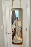 Having an elopement in the CA redwoods and was looking for something with a Stevie Nicks vibe that was comfy enough to traipse around in all day, and this is going to be PERFECT! The fabric around the shoulders is a bit snug, but moving up to a L would be too big. The sleeves have enough stretch, so if you're a weight-lifting girl like myself there is some forgiveness with these not being too tight on your arms. The train is a perfect length so that it'll look dreamy in the photos, but you can still pick it up to move around. Can't wait to wear it, and such a steal at this price! - Danielle G.