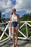 This shirt looks just like it does in the pictures but even better. There's a second layer underneath with an elastic band, so it's completely secure even in windy weather (so great for tropical vacations). Looks great with high waisted jeans/shorts. Definitely buy this! - Rachel D.