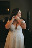Lulus absolutely saved my wedding! My original dress was butchered at the tailor so I panicked and ordered 10 dresses from Lulus a month before my wedding. They were shipped super quick and I ended up loving this dress even more than my original. I put it on and immediately felt like a princess. I ordered the largest size. I was able to get it zipped but it was VERY snug. I ended up taking it to a new tailor and had the zipper replaced with a lace-up back for a better fit. I loved this dress so, so much and felt so beautiful in it! - Destiney M.