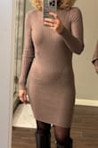 I ordered this dress in brown and black in size small. Both fit like a glove! I definitely would wear a control top hose for a smoother look. Very happy with my purchase. - Lisa L.