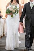 I had such a hard time finding a wedding dress that wasn't itchy and heavy. This dress fits like a glove. The material it's lined with is very soft. The lace detail is absolutely beautiful. I felt like a million bucks on my wedding day! - Isabella C.