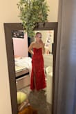 The dress that the model has on is supposedly an "XS" which is why I purchased an xs, but was too small on me. Nothing too bad. It just didn't reach the floor and wouldn't zip comfortably. All around a good quality dress. I would just double-check the size measurements! - Ellie F.