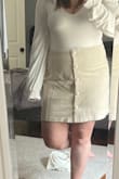 Super cute skirt. It runs a little large/long, but it closes through the buttons on the front (they aren't decorative) so it's better that is slightly larger as the buttons don't gap. - Sam B.