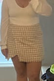 I'm obsessed with this skirt, but it runs so short. I sized up hoping to gain length and it just made the waist larger, not so much longer. With the split in the front, when you sit you can be in danger of flashing with how the split lays and the general length. So flattering and cute though, if it was just a little longer it would be perfect. Or if it's for a mainly standing event - definitely get this skirt. - Sam B.
