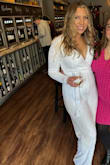 This jumpsuit was GORG! I got so many compliments on my Bach party! The material was thick, the length was great. I was shining and the center of attention!! The jumpsuit was comfortable and easy to dance and move in! The bust was definitely a little more open than I'd prefer, but I used a safety pin. - Melissa O.