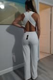 I love this jumpsuit. I tried it on and it's the perfect fit for me. The material is thick and not see through. I can't wait to wear it the weekend of my destination wedding. - Heidy S.