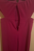 I bought this jumpsuit for an event, and the first item received had a defective zipper, which broke before I even tried it. I requested a second jumpsuit and thought this was a good hit, so I took the jumpsuit to the dry cleaners to iron it. On the day of the event, I attempted to bring the zipper up and BOOM! The zipper was defective again and didn't move up or down, and I was not able to wear it. I'm so upset that I ended up using a different outfit, and now I have this piece in my closet with a broken zipper. Unable to return it as all tags were removed. I would not recommend it! - MB B.