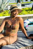 Loved the little sparkle and quality in the suit. I also appreciate the versatility of the front of the bathing suit; I tied it in the front instead of around my neck. I have a long torso but a small bust, so the stretch was great! - J. D.