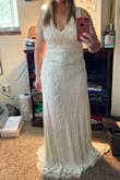 Absolutely love this dress and the way it flows and falls on my body. I have always been curvy so dress fitting has been a very unique process. I am also short so hemming is needed, which I anticipated but refuse to pay more than the dress for this. I am grateful to have a seamstress that will hem for $200! This dress has stunning beadwork and lays beautifully. - Jennifer M.
