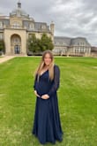 Super pretty dress! Perfect for a formal event! It was made very well quality-wise! I did have to add a button because it was very low cut in the front but other than that, it fit wonderfully. Also, I am 6 months pregnant and it was very bump friendly. :) - Erin H.
