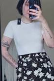 Fits well and is a nice material but despite the reviews saying it wasn't see-through, my chest and tattoo are still visible but it still ranks higher on my white shirt opaqueness scale (photo altered to prevent nip showing). - Rory C.