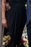 I bought this dress to wear to a holiday gala. The material of the dress is so soft and it hugs in all the right places. Also, it didn't need to be ironed which was a big plus for me. It is cut very low in the chest area so I ended up pinning it a little to avoid any accidents. - Sylvia W.